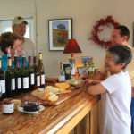 Visitors tasting with owners