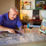 Man working on puzzle